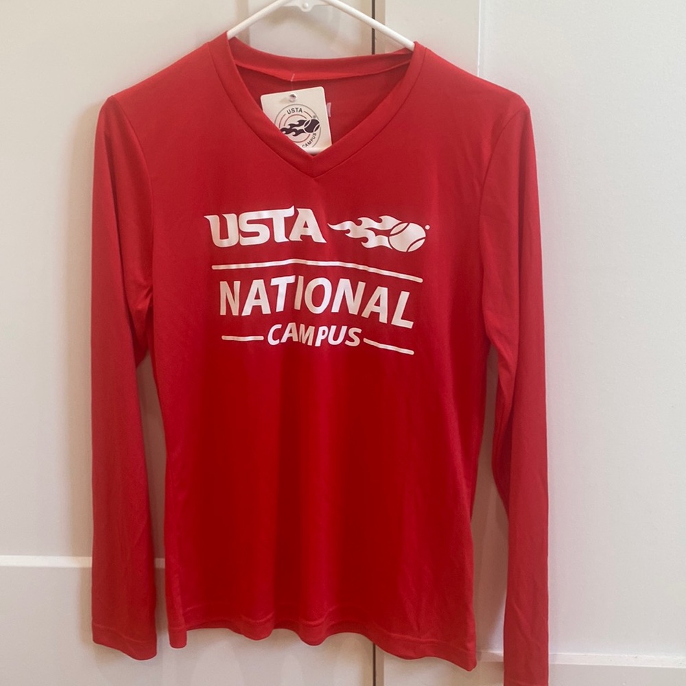 This is a red tennis long sleeve shirt. It is red.
